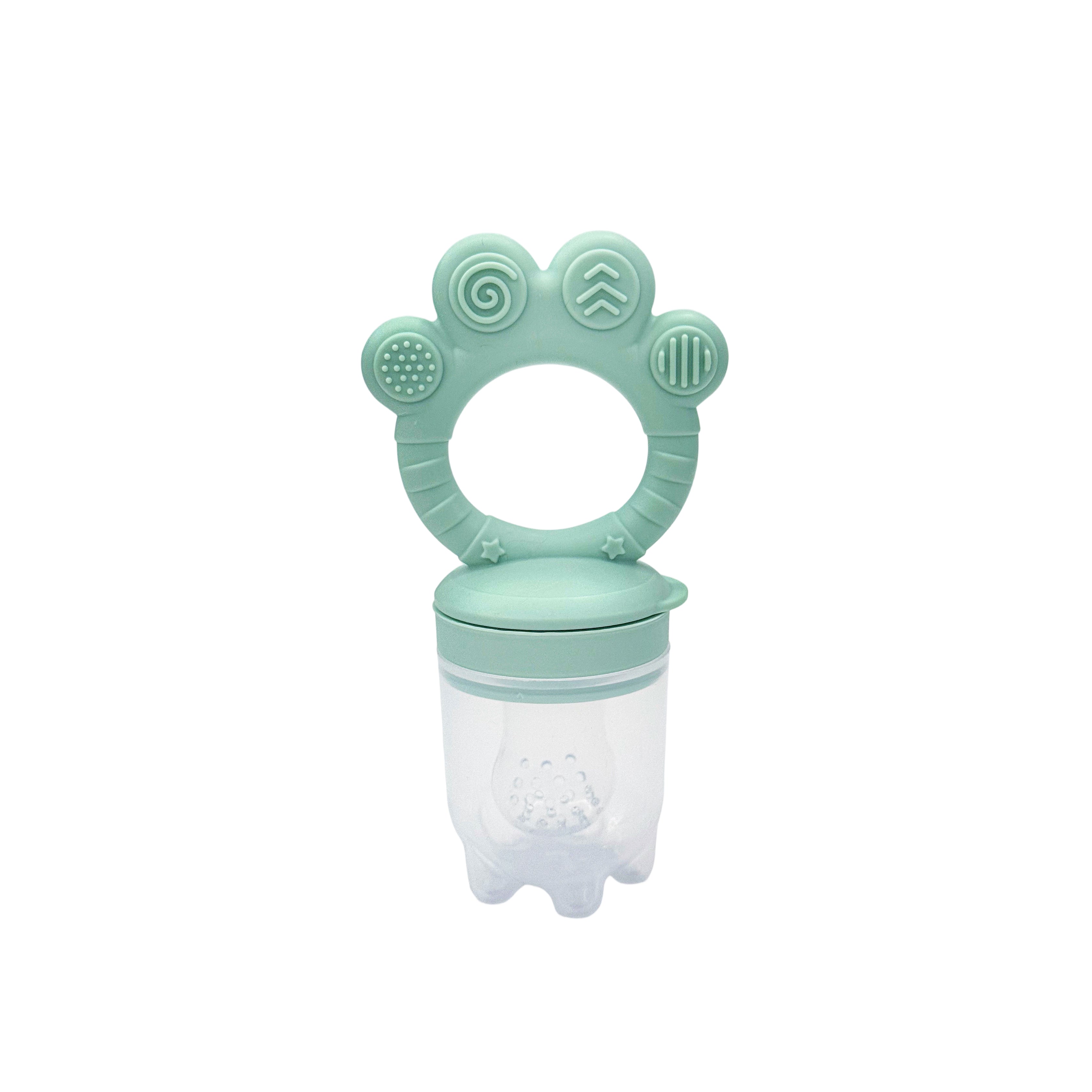 The NubiTeethe™ Multi-Flow Teether Bottle is a teal and clear food-grade silicone feeder with a ring handle and textured patterns, designed to soothe baby gums and help introduce solid foods.